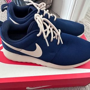 Navy blue and beige Nike roshe one
